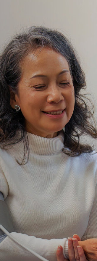 A nurse monitoring the health of an elderly woman