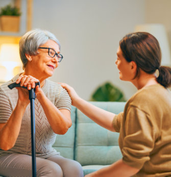 A woman talking to an elderly woman