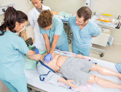 A group of healthcare staff training on cpr