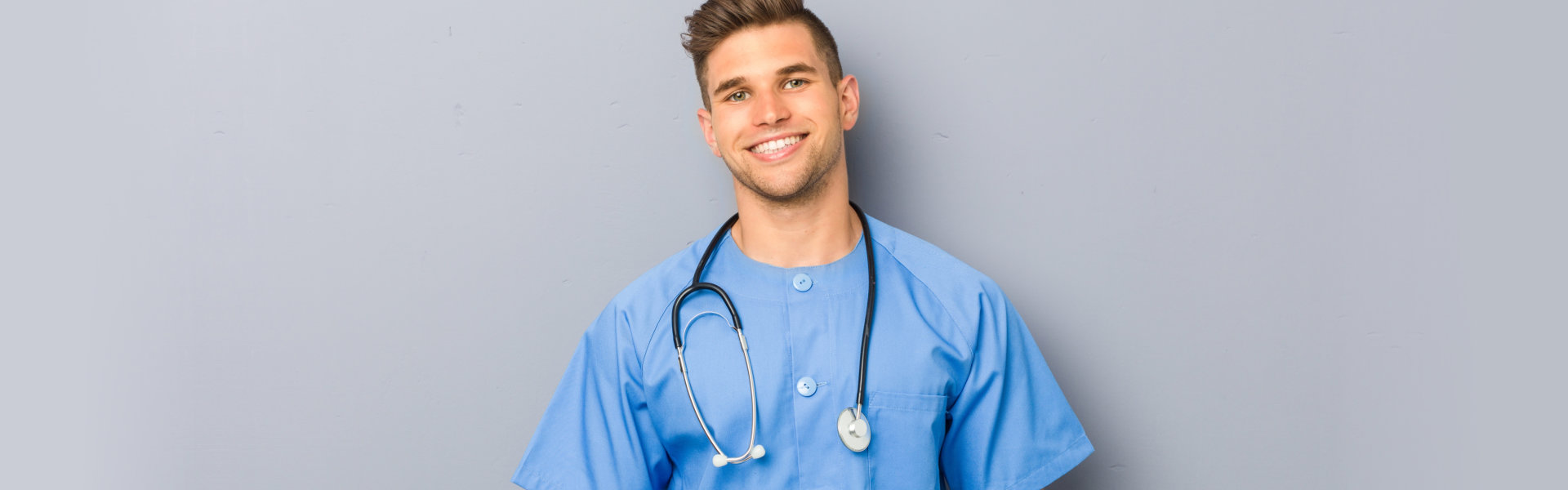 A male nurse smiling